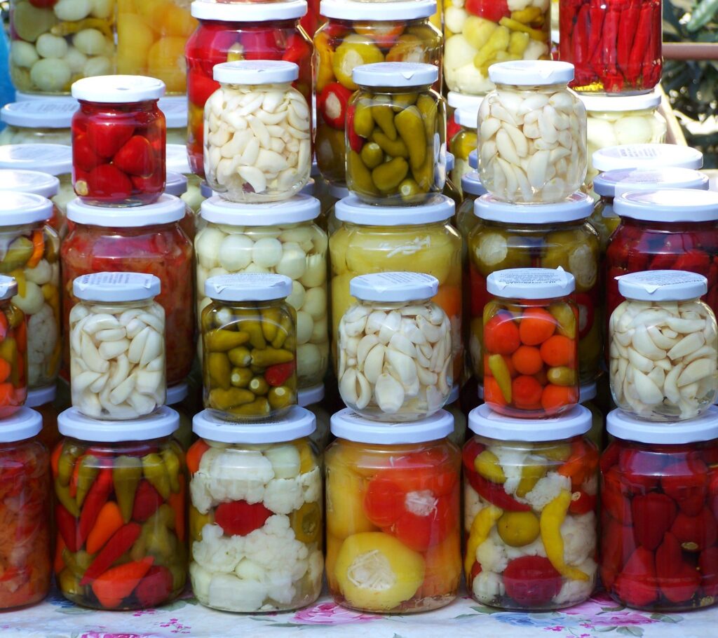 Jars of pickled vegetables stacked up