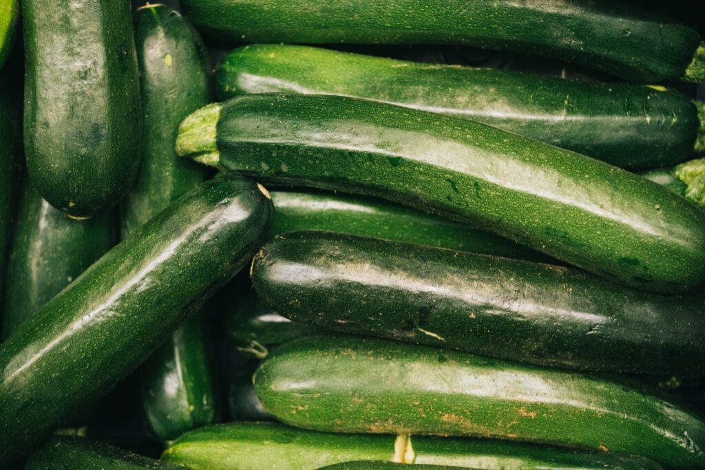 A pile of green courgettes