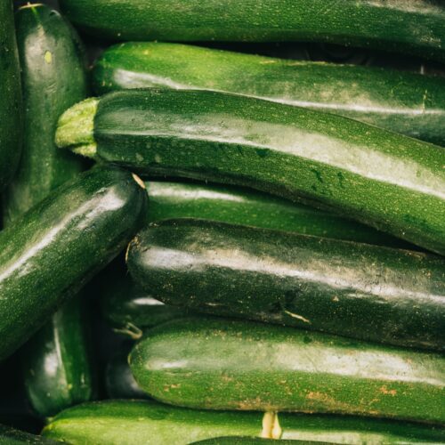 A pile of green courgettes