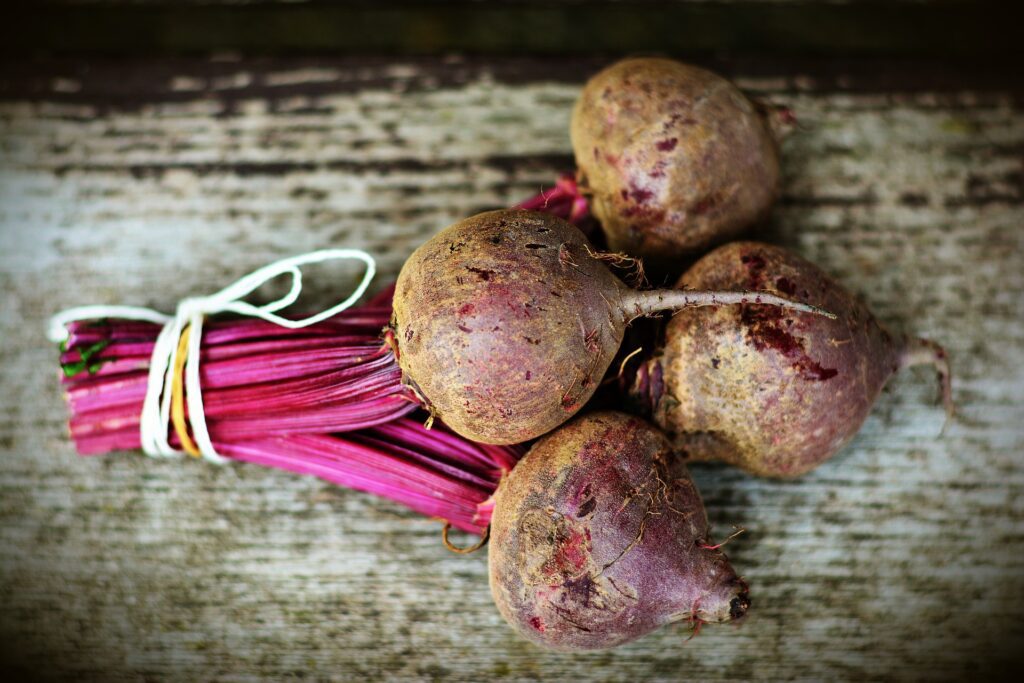 Beetroot bulbs on a board