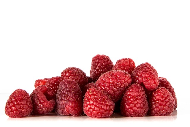 A small mound of fresh raspberries