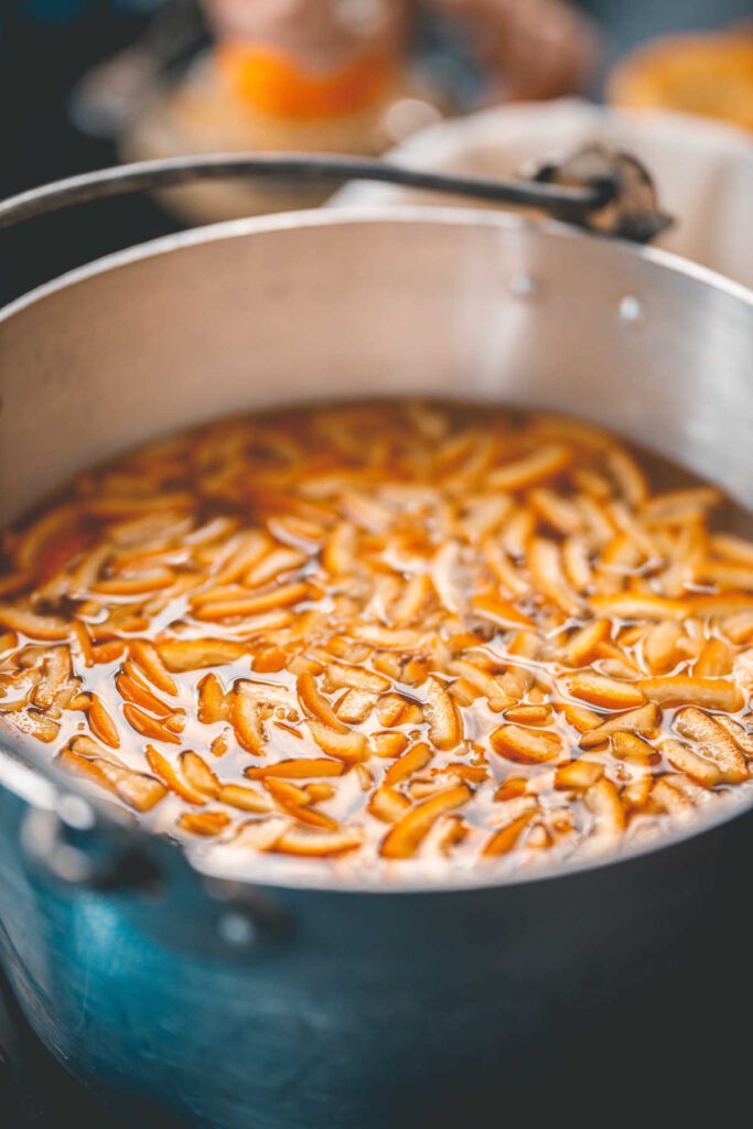 Stainless steel preserving pan with content for marmalade