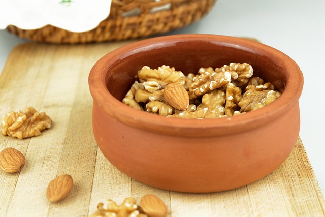 Walnuts and almonds in a terracotta bowl