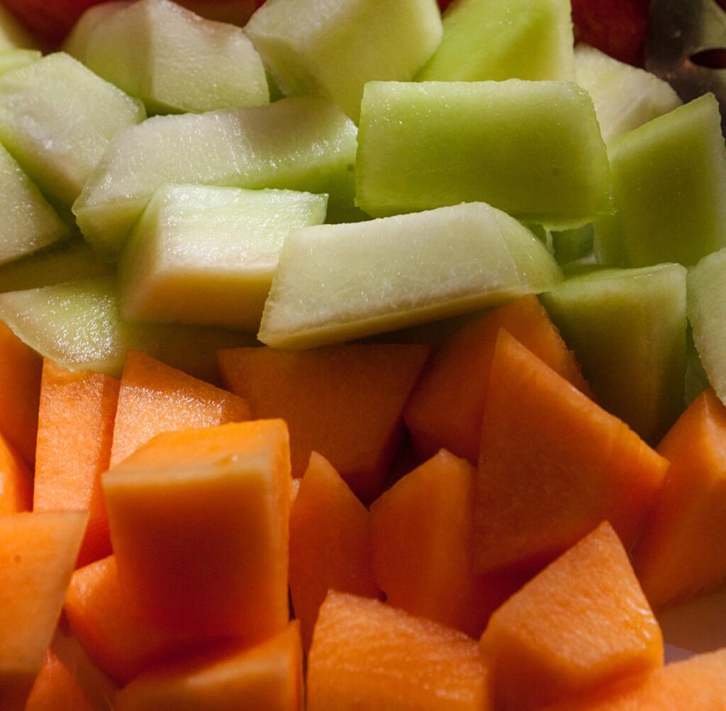 Chopped pieces of orange and green melon