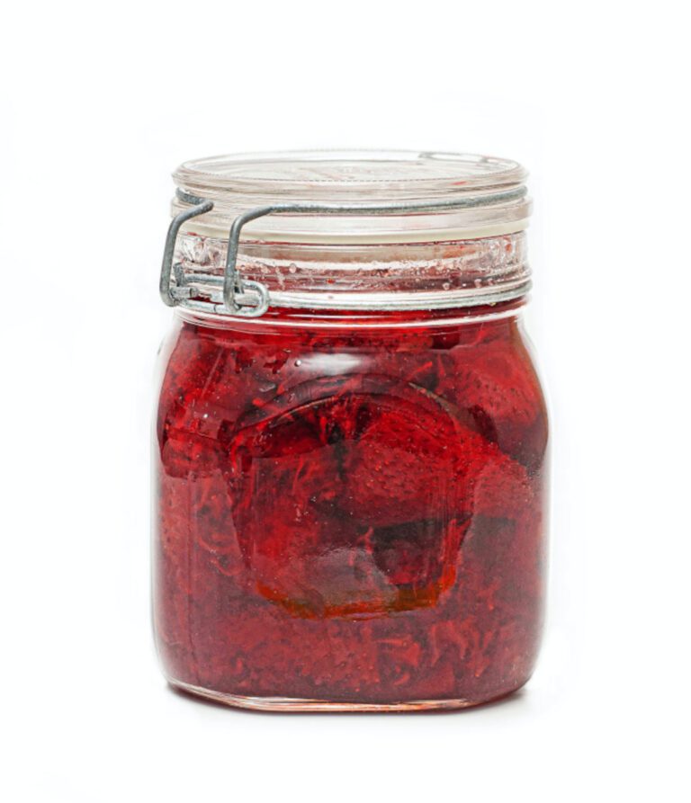 A sealed glass jar of strawberry jam